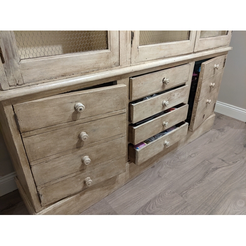 606 - Country lime wash pine kitchen dresser, with three mesh doors above four central drawers flanked by ... 