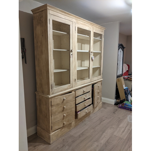 606 - Country lime wash pine kitchen dresser, with three mesh doors above four central drawers flanked by ... 