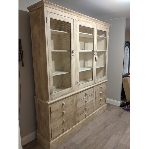 606 - Country lime wash pine kitchen dresser, with three mesh doors above four central drawers flanked by ... 