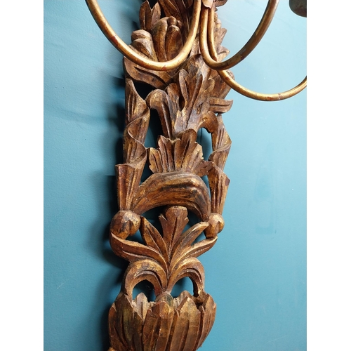 608 - Pair of good quality giltwood wall lights decorated with foliage. {122 cm H x 45 cm W x 30 cm D}.