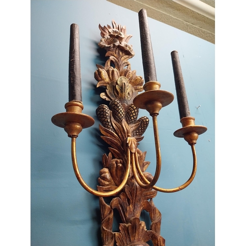 608 - Pair of good quality giltwood wall lights decorated with foliage. {122 cm H x 45 cm W x 30 cm D}.