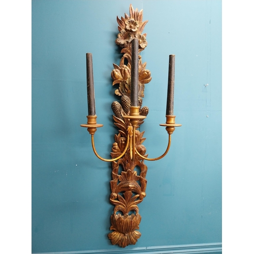 608 - Pair of good quality giltwood wall lights decorated with foliage. {122 cm H x 45 cm W x 30 cm D}.