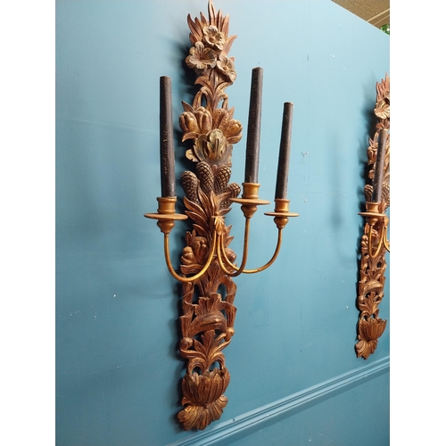 608 - Pair of good quality giltwood wall lights decorated with foliage. {122 cm H x 45 cm W x 30 cm D}.