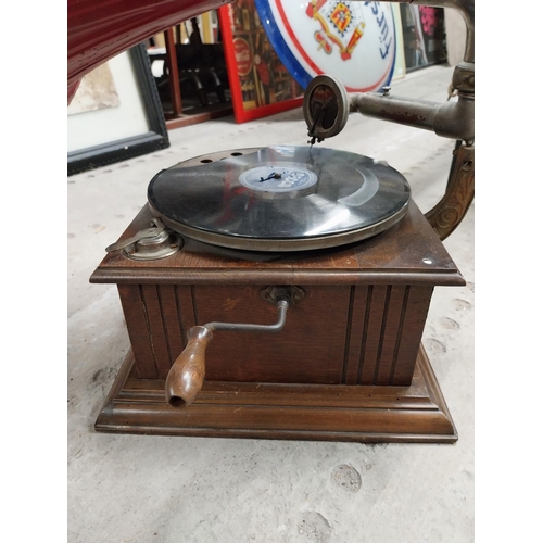 702 - Early 20th C. oak cased gramophone with painted metal horn {67 cm H x 63 cm  W x 53 cm D}.