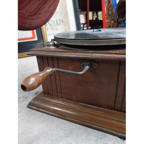 702 - Early 20th C. oak cased gramophone with painted metal horn {67 cm H x 63 cm  W x 53 cm D}.