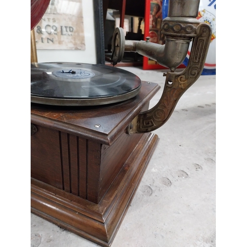 702 - Early 20th C. oak cased gramophone with painted metal horn {67 cm H x 63 cm  W x 53 cm D}.