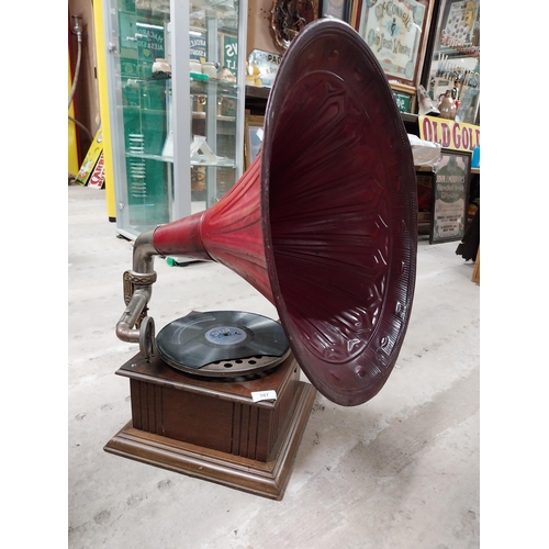 702 - Early 20th C. oak cased gramophone with painted metal horn {67 cm H x 63 cm  W x 53 cm D}.