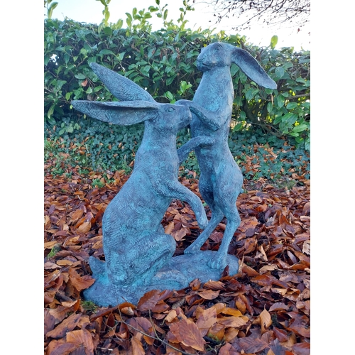 745 - Pair of exceptional quality verdigris bronze  hares at play {78cm H x 75cm W x 37cm D}