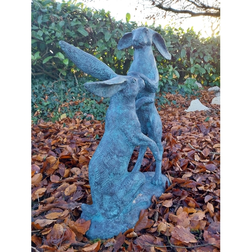 745 - Pair of exceptional quality verdigris bronze  hares at play {78cm H x 75cm W x 37cm D}