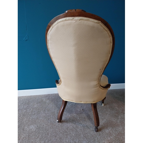 785 - Victorian mahogany and upholstered nursing chair raised on cabriole legs with brass and ceramic cast... 