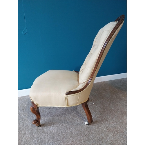 785 - Victorian mahogany and upholstered nursing chair raised on cabriole legs with brass and ceramic cast... 