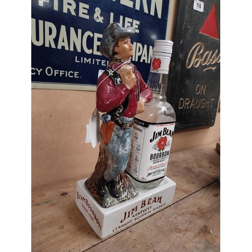 105 - Jim Beam Kentucky Bourbon ceramic advertising bottle holder in the form of a Cowboy and bottle. {34 ... 