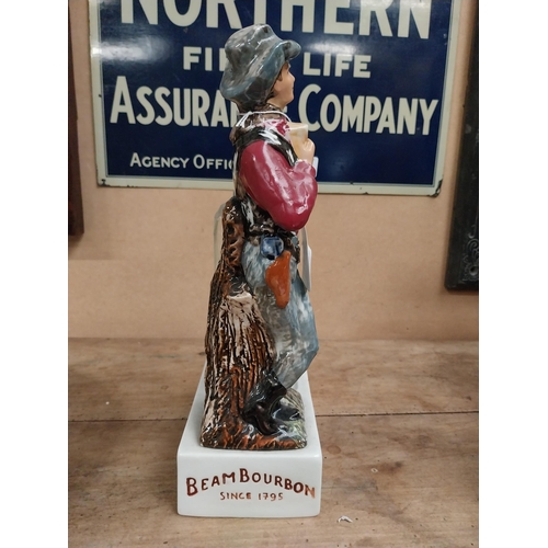 105 - Jim Beam Kentucky Bourbon ceramic advertising bottle holder in the form of a Cowboy and bottle. {34 ... 