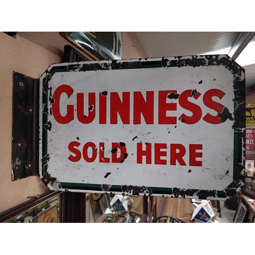 108 - Guinness Sold Here double sided enamel advertising sign. {21 cm H x 47 cm W}