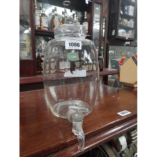 1086 - Early 20th C. glass whiskey dispenser. {34 cm H x 20 cm W x 30 cm W}.