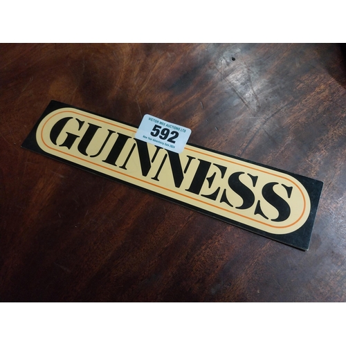 592 - Guinness Perspex stick on shelf sign. {6 cm H x 26 cm W}.