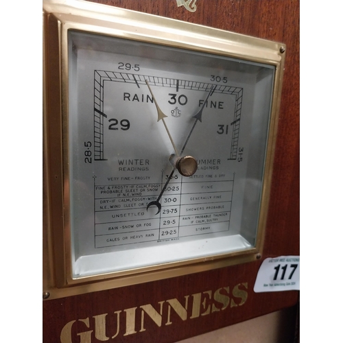 117 - Guinness mahogany Barometer. {23 cm H x 23 cm W}.