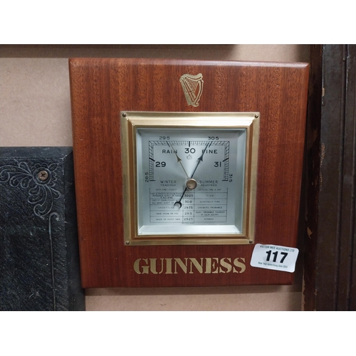 117 - Guinness mahogany Barometer. {23 cm H x 23 cm W}.