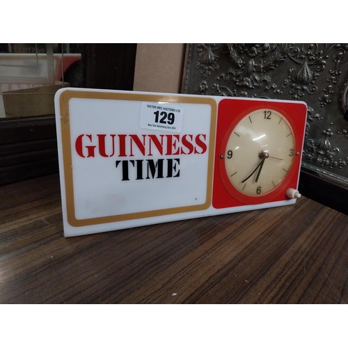 129 - Guinness Time Perspex battery operated advertising clock. {15 cm H x 30 cm W}.