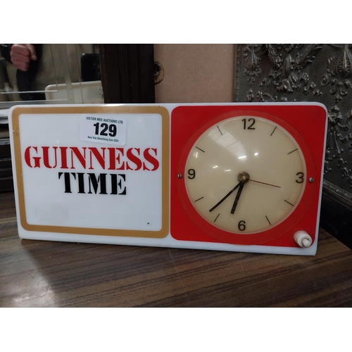 129 - Guinness Time Perspex battery operated advertising clock. {15 cm H x 30 cm W}.