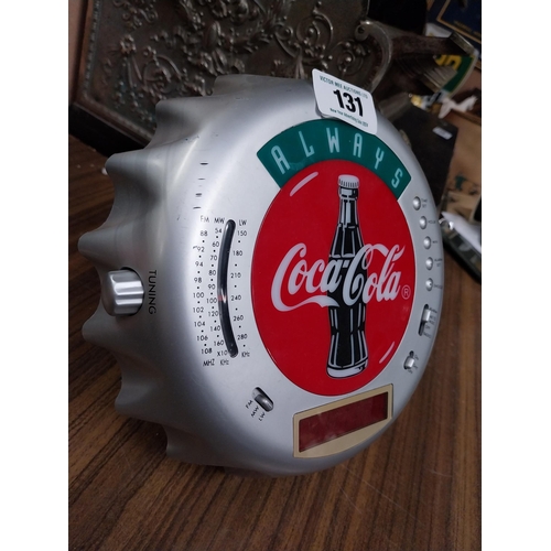 131 - Coca Cola radio in form of bottle top. {5 cm H x 24 cm Diam}