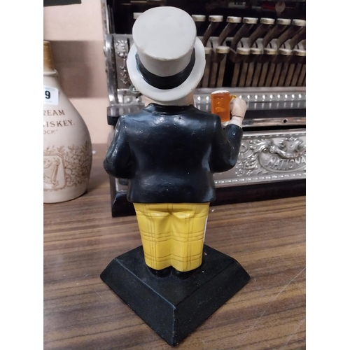 143 - William Younger Ruberoid advertising figure. {23 cm H x 13 cm W x 11 cm D}.