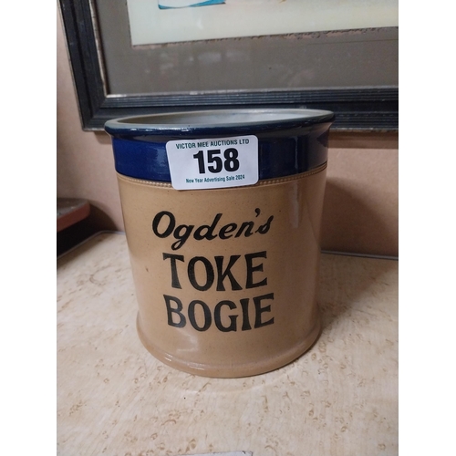 158 - Ogden's Toke Bogie stoneware tobacco jar. {16 cm H x 15 cm Dia.}