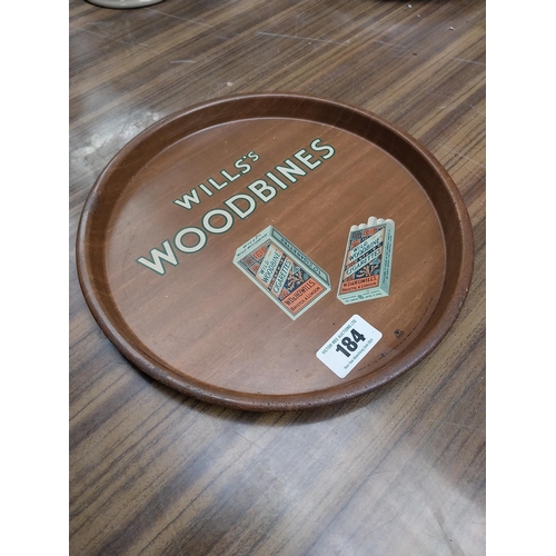 184 - Wills's Woodbine tin plate advertising tray. {31 cm Dia.}