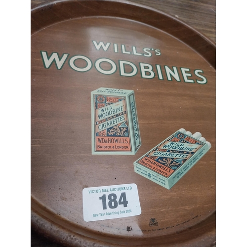 184 - Wills's Woodbine tin plate advertising tray. {31 cm Dia.}