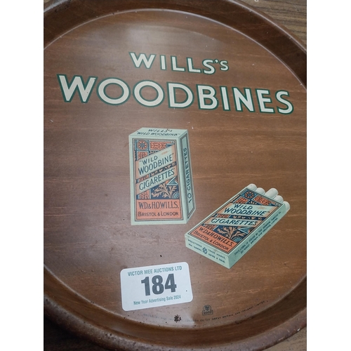 184 - Wills's Woodbine tin plate advertising tray. {31 cm Dia.}