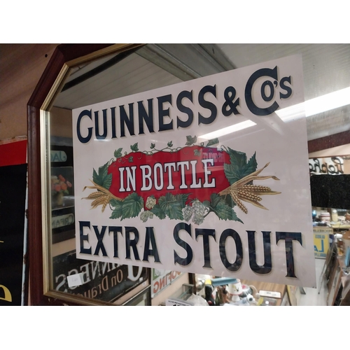 188 - Guinness Extra Stout In Bottle framed advertising mirror. {55 cm H x 68 cm W}.