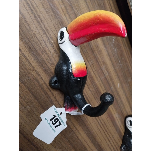 197 - Two cast iron Guinness Toucans in the form of coat hangers. {14 cm H x 11 cm W}.