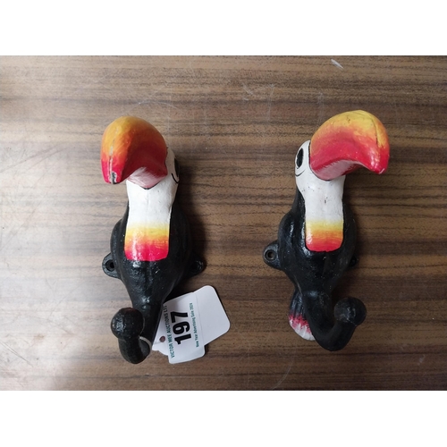 197 - Two cast iron Guinness Toucans in the form of coat hangers. {14 cm H x 11 cm W}.