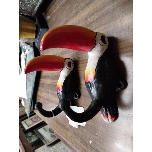 197 - Two cast iron Guinness Toucans in the form of coat hangers. {14 cm H x 11 cm W}.