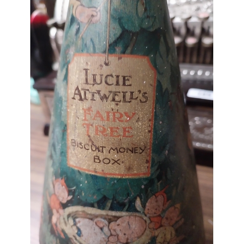 199 - Lucie Attwells's Fairy Tree tin plate advertising money box. {38 cm H x 15 cm Dia.}.