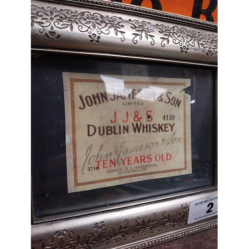 2 - Framed John Jameson advertising label. {20 cm H x 26 cm D}.