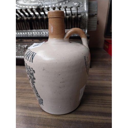 200 - Cruskeen Lawn stoneware advertising flagon. {20 cm H x 13 cm Diam}.