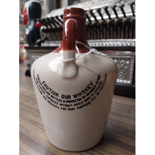 201 - Kilbeggan Irish Whiskey stoneware flagon. {19 cm H x 12 cm Dia.}.