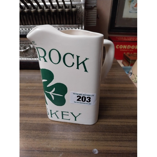 203 - Shamrock Whiskey ceramic advertising water jug. {18 cm H x 17 cm W x 11 cm D}.