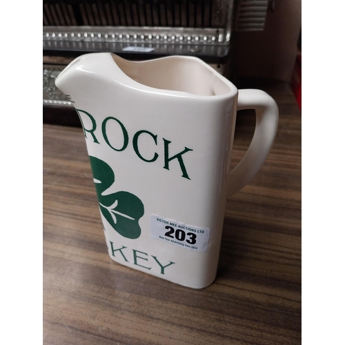 203 - Shamrock Whiskey ceramic advertising water jug. {18 cm H x 17 cm W x 11 cm D}.