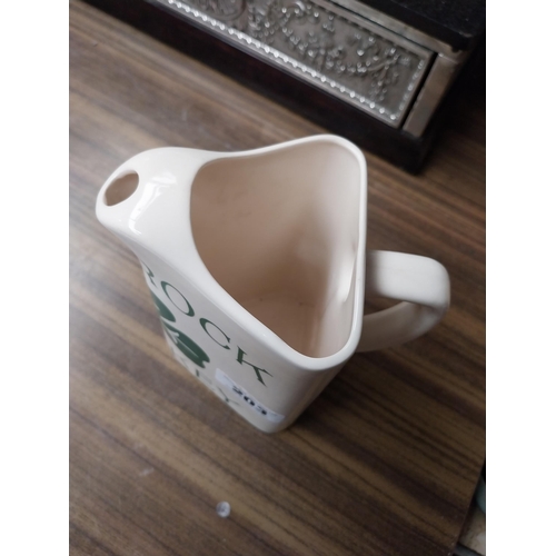 203 - Shamrock Whiskey ceramic advertising water jug. {18 cm H x 17 cm W x 11 cm D}.