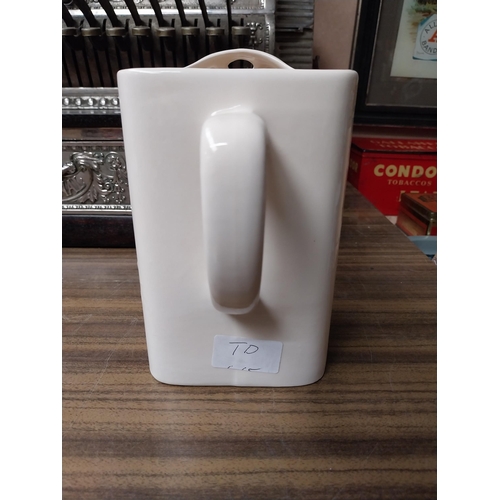 203 - Shamrock Whiskey ceramic advertising water jug. {18 cm H x 17 cm W x 11 cm D}.