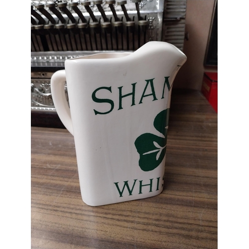 203 - Shamrock Whiskey ceramic advertising water jug. {18 cm H x 17 cm W x 11 cm D}.