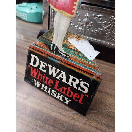 209 - Dewar's White Label Whisky tinplate advertising figure of a butler. { 25cm H X 11cm W }.