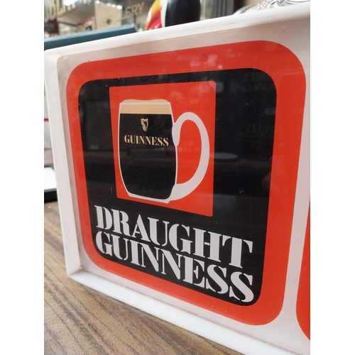 210 - Draught Guinness Perspex battery advertising clock. {18 cm H x 27 cm W x 8 cm D}.