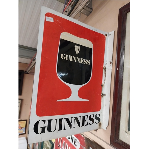 215 - Guinness tinplate double sided advertising sign {62 cm H x 44 cm W}.