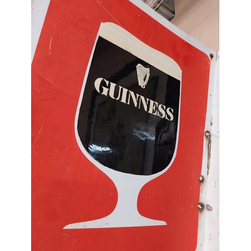 215 - Guinness tinplate double sided advertising sign {62 cm H x 44 cm W}.