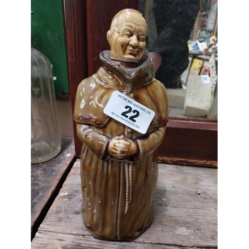 22 - Two Scotch Whiskey ceramic advertising bottles in the form of Monks. {28 cm H x 10 cm Dia.}.