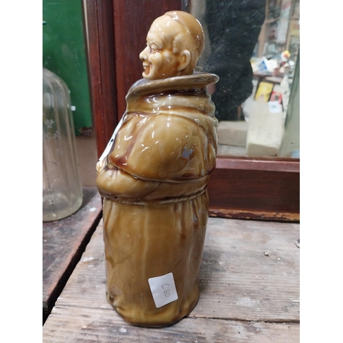 22 - Two Scotch Whiskey ceramic advertising bottles in the form of Monks. {28 cm H x 10 cm Dia.}.