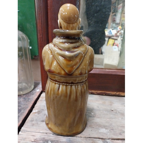 22 - Two Scotch Whiskey ceramic advertising bottles in the form of Monks. {28 cm H x 10 cm Dia.}.